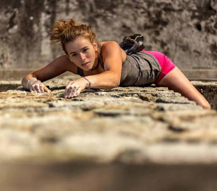 young rock climbing girl