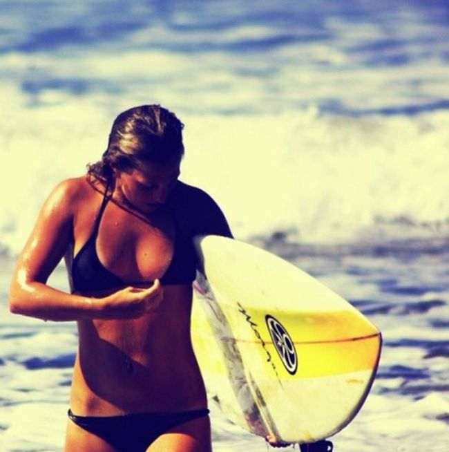 young surfing girl