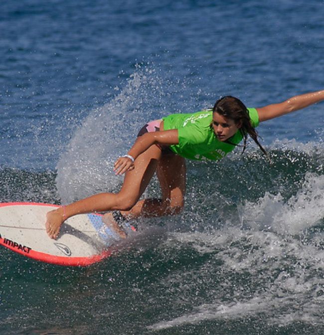 young surfing girl