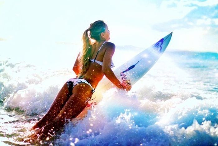 young surfing girl