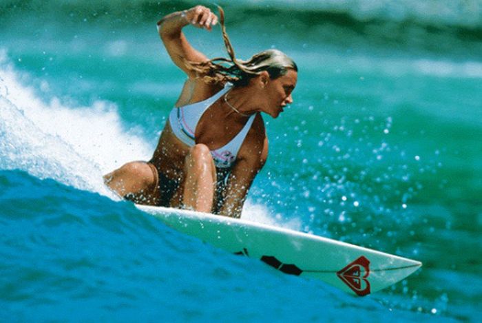 young surfing girl