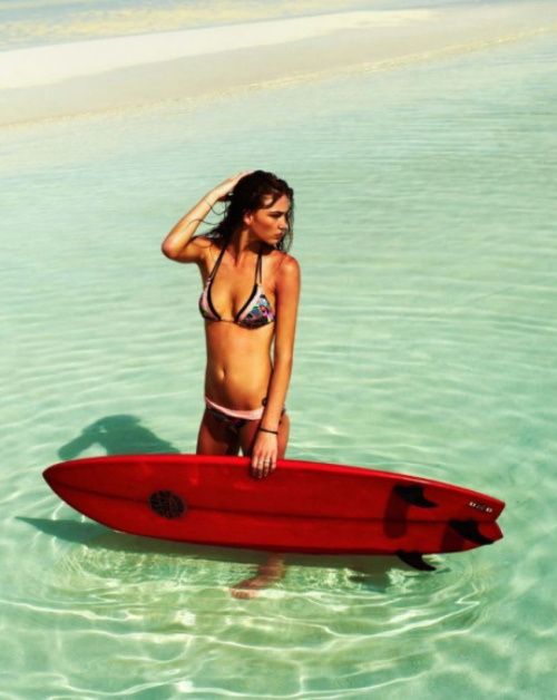 young surfing girl