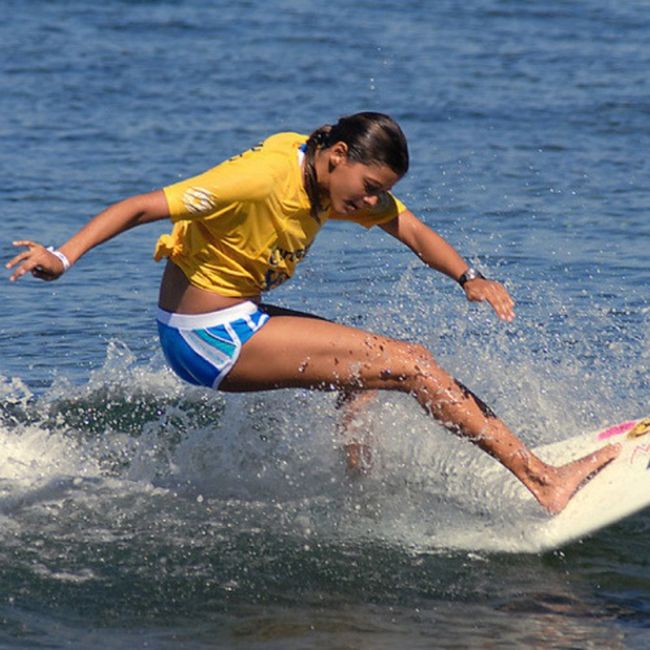 young surfing girl