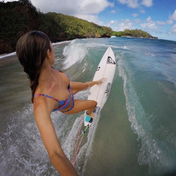 young surfing girl