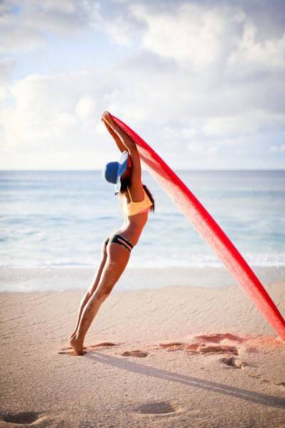 young surfing girl