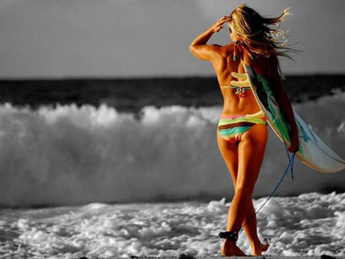 young surfing girl