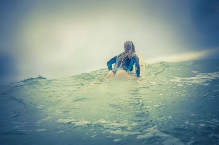 young surfing girl