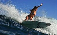 Sport and Fitness: young surfing girl