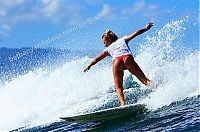 Sport and Fitness: young surfing girl