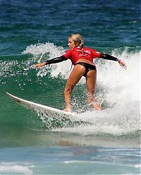 Sport and Fitness: young surfing girl