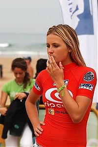 Sport and Fitness: young surfing girl