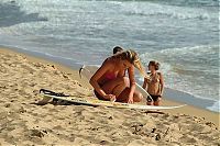 Sport and Fitness: young surfing girl