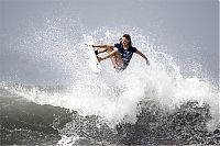 Sport and Fitness: young surfing girl