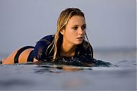 Sport and Fitness: young surfing girl