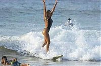 Sport and Fitness: young surfing girl