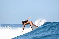 Sport and Fitness: young surfing girl