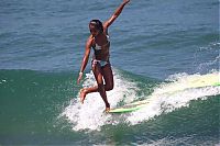 Sport and Fitness: young surfing girl