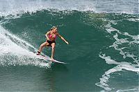 Sport and Fitness: young surfing girl