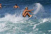 Sport and Fitness: young surfing girl