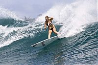 Sport and Fitness: young surfing girl