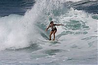 Sport and Fitness: young surfing girl