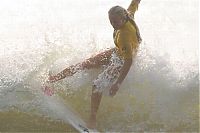 Sport and Fitness: young surfing girl