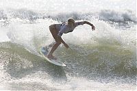 Sport and Fitness: young surfing girl