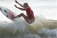 Sport and Fitness: young surfing girl