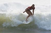 Sport and Fitness: young surfing girl