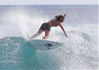 Sport and Fitness: young surfing girl