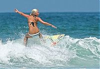 Sport and Fitness: young surfing girl