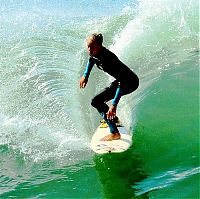 Sport and Fitness: young surfing girl