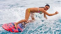 Sport and Fitness: young surfing girl