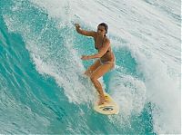 Sport and Fitness: young surfing girl