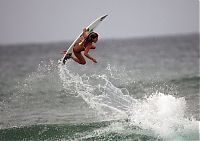 Sport and Fitness: young surfing girl