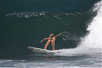 Sport and Fitness: young surfing girl