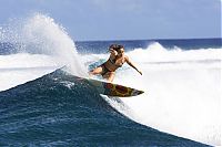 Sport and Fitness: young surfing girl