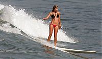 Sport and Fitness: young surfing girl