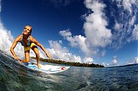 Sport and Fitness: young surfing girl