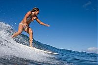 Sport and Fitness: young surfing girl