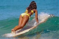 Sport and Fitness: young surfing girl