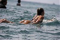 Sport and Fitness: young surfing girl