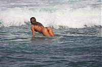 Sport and Fitness: young surfing girl