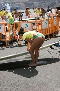 Sport and Fitness: young surfing girl