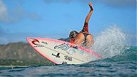 Sport and Fitness: young surfing girl