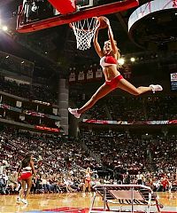 Sport and Fitness: NBA girl making a slam dunk