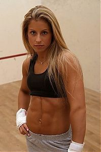 Sport and Fitness: strong fitness bodybuilding girl with abdominal six-pack belly muscles