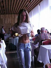 Sport and Fitness: strong fitness bodybuilding girl with abdominal six-pack belly muscles