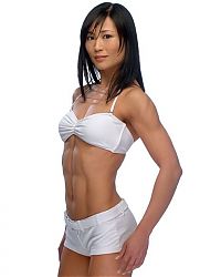 Sport and Fitness: strong fitness bodybuilding girl with abdominal six-pack belly muscles