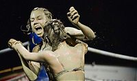 Sport and Fitness: bikini girls mud wrestling